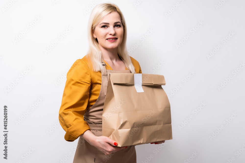 picture of attractive businesswoman delivering box picture of attractive businesswoman delivering box