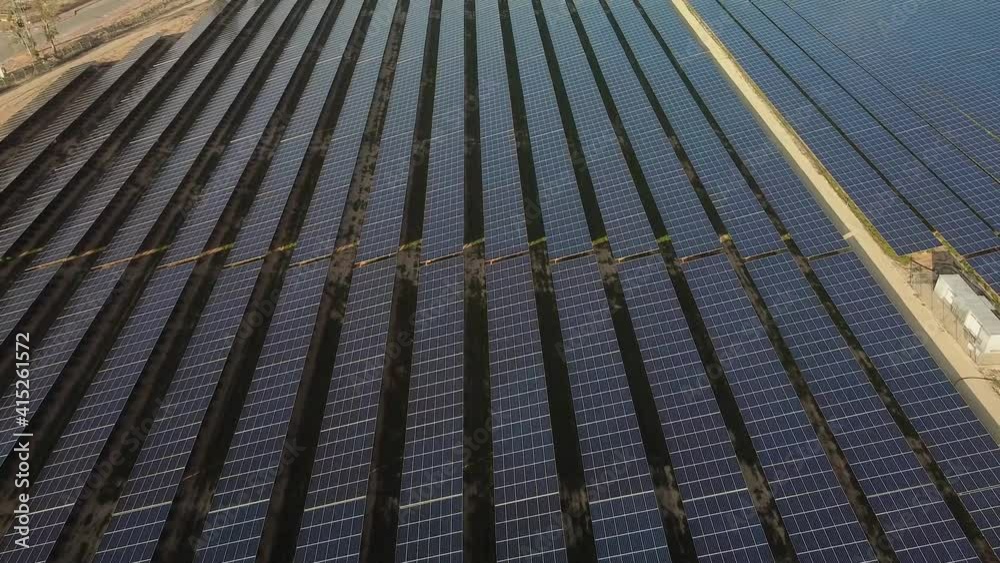 Close-up view from top on solar panels power station in desert at winter morning