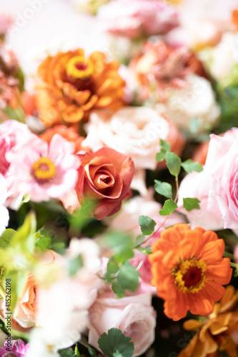 wedding ceremony is decorated with flower arrangements