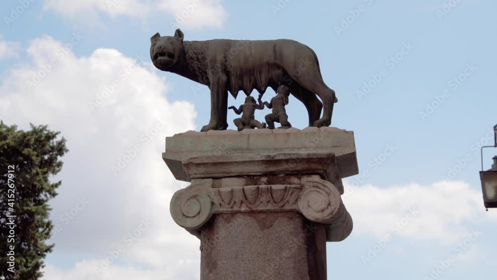 Romanulus Statue of she-wolf on Capitoline hill against blue sky. Twins founders ...