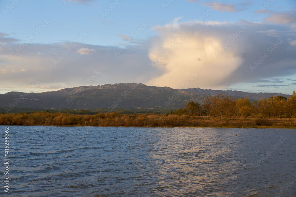 Lake view at sunset with Gardunha mountains on the background at sunset in Castelo Branco, Portugal