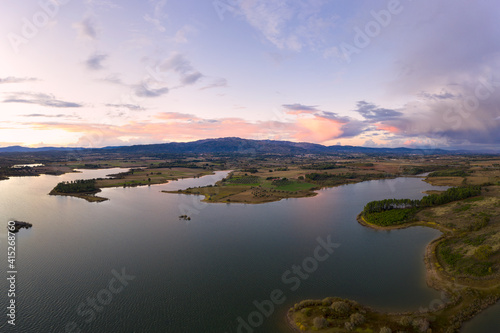 Lake drone aerial view of mountain panorama landscape at sunset in Marateca Dam in Castelo Branco, Portugal