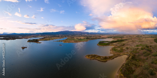 Lake drone aerial view of mountain panorama landscape at sunset in Marateca Dam in Castelo Branco, Portugal