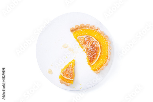 Traditional french lemon tart, top viewTraditional french lemon tart, with orange slice photo