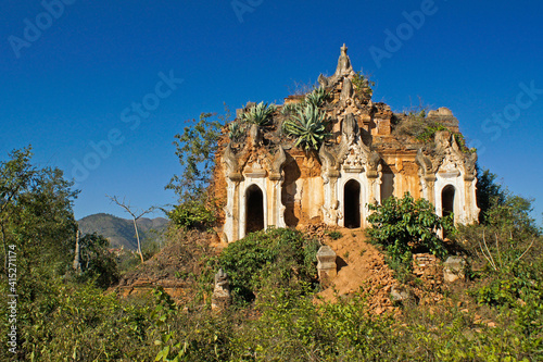 Overgrown ruins of old pagoda, In Dein, Inle Lake, Myanmar (Burma)