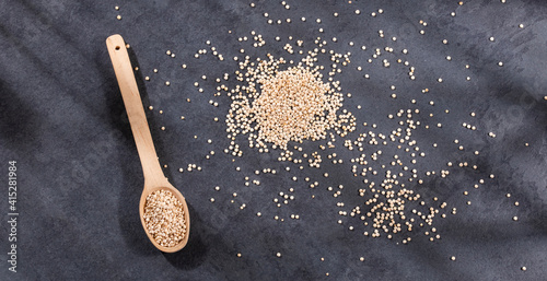 Organic quinoa seeds in wooden spoon - Chenopodium quinoa