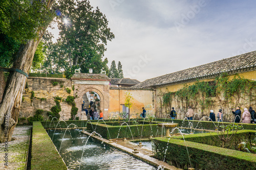 Inside the Generalife palace (part of the Alhambra complex in Granada, Spain), gardens and fountains welcome the visitor. 