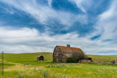 Blue sky over an old, abandoned prairie barn in the Flintoft-Lankenheath area of Saskatchewan photo