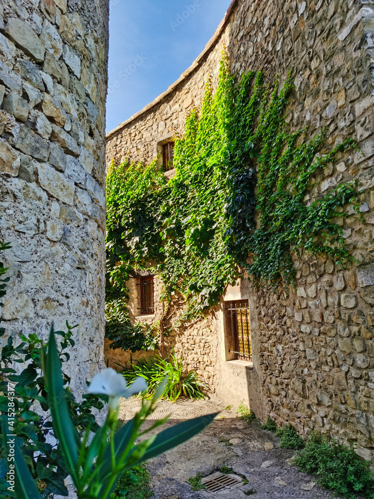 Narrow street in the medieval village of Mirmande, Provence, south of France.