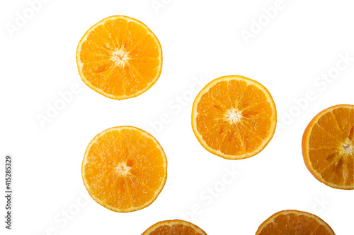 Slices of orange or tangerine isolated on white background. Flat lay  top view. Fruit composition