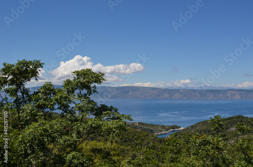 Beautiful landscape in Hvar, Croatia with greenery, sea, hills and clouds © IdosoTambm