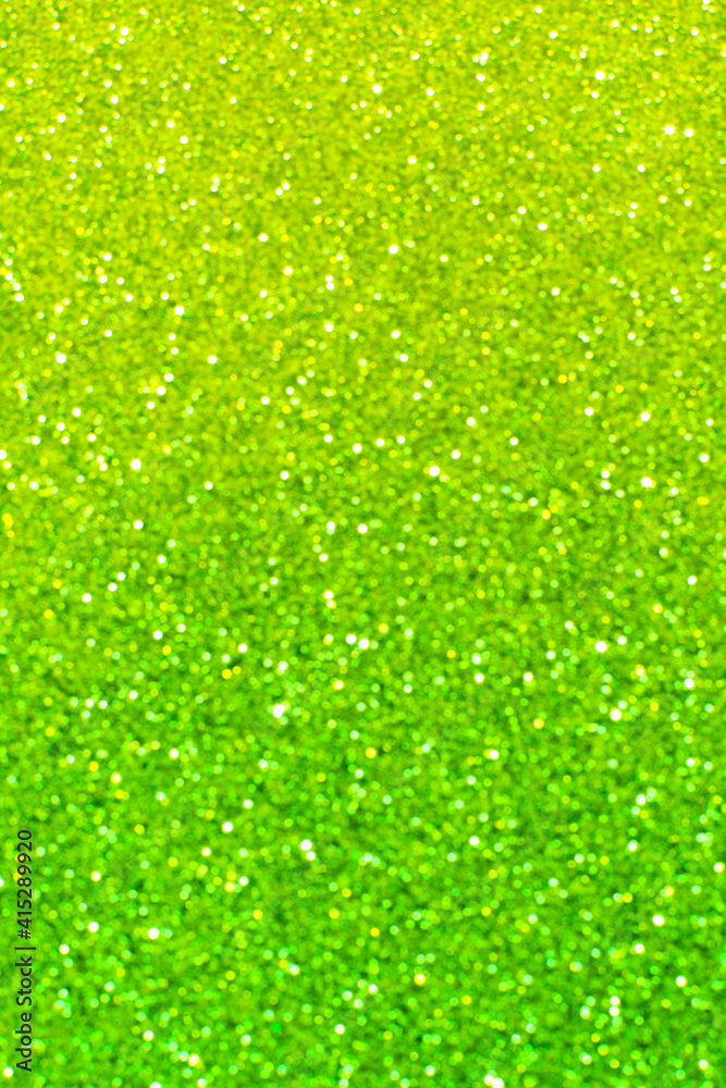 Abstract lime and emerald green and yellow glitter bokeh background. Festive backdrop for St. Patrick's Day, christmas, spring, holiday or event Abstract lime and emerald green and yellow glitter bokeh background. Festive backdrop for St. Patrick's Day, christmas, spring, holiday or event