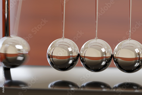 Konstfotografi Close up of Newton's cradle swinging. 3d illustration.