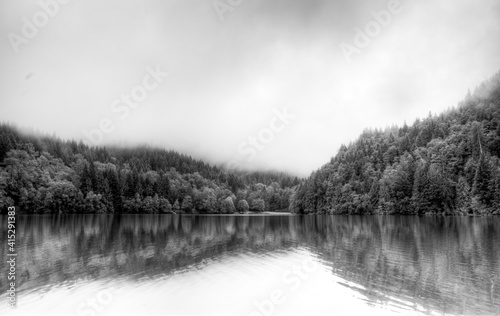 looking across a lake on a misty autumn, day, Alice Lake Provincial Park, Vancouver, British Columbia, Canada