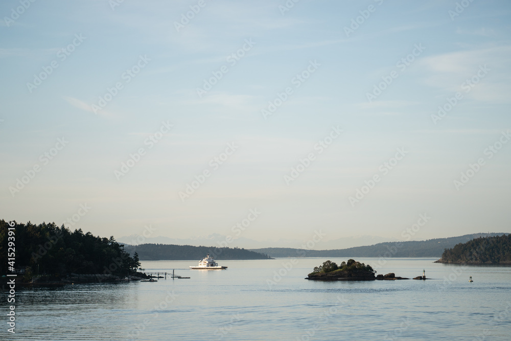view of a ferry sailing through the Gulf Islands near Victoria, BC, Canada