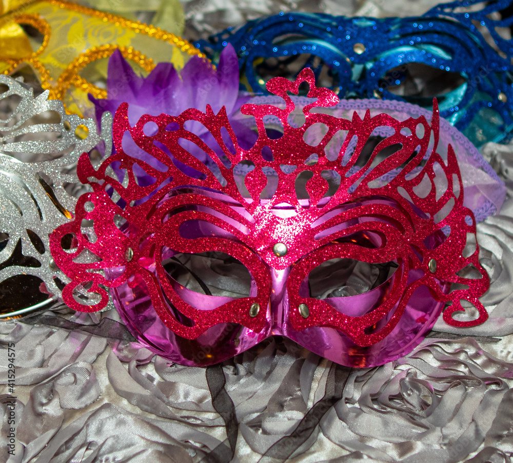 Colorful masquerade masks on a table Colorful masquerade masks on a table