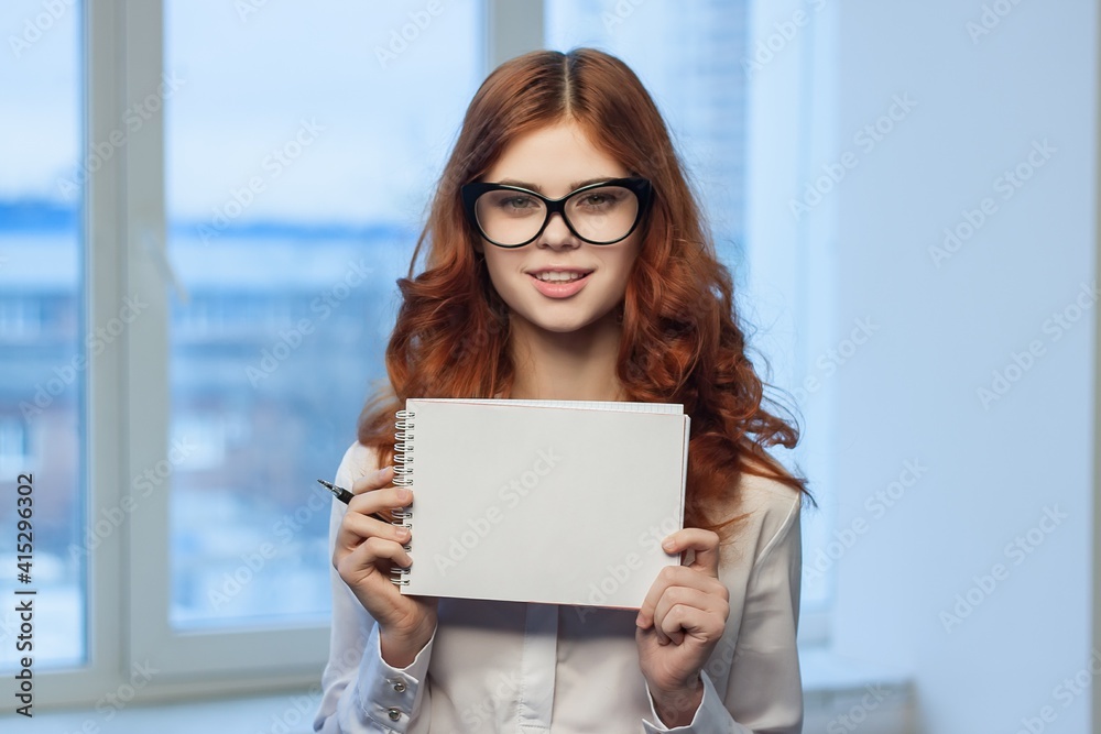Business woman in office holding notepad in hands of documents Professional manager Business woman in office holding notepad in hands of documents Professional manager