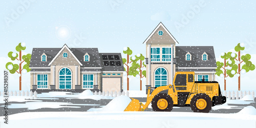 Snow plow truck cleaning snows area streets at village home.