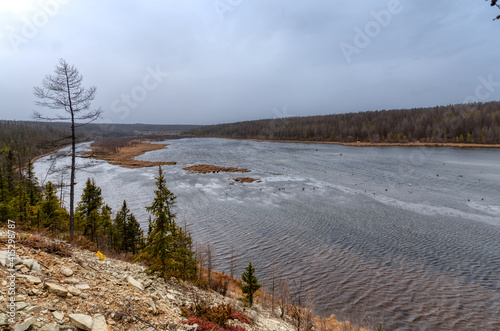 Fototapeta Naklejka Na Ścianę i Meble -  The banks of a wide taiga river. Irelyakh River, Yakutia Russia