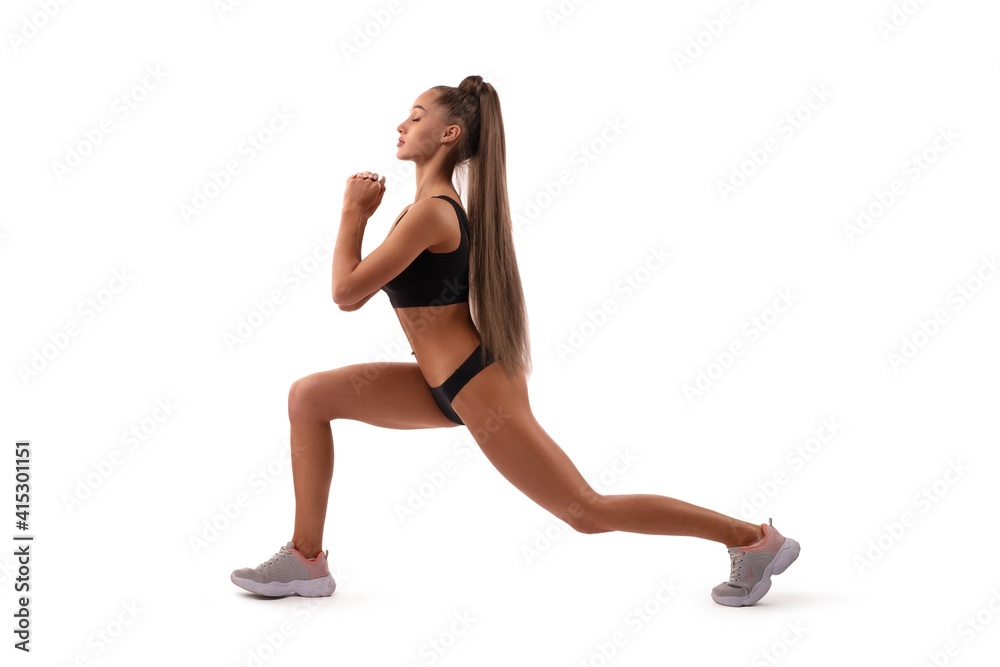 Smiling fit woman in underwear doing sport exercise in studio Smiling fit woman in underwear doing sport exercise in studio