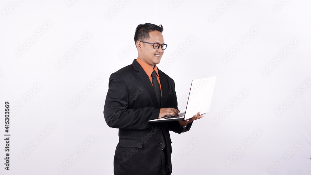 businessman in a suit holding a laptop computer and looking at the camera isolated on white background businessman in a suit holding a laptop computer and looking at the camera isolated on white background