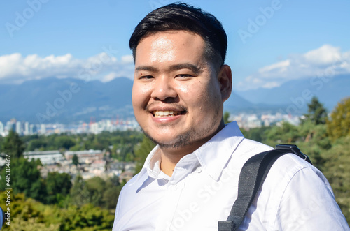 head and shoulders portrait of an asian man in canada © Surakit