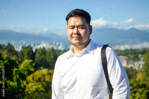 head and shoulders portrait of an asian man in canada