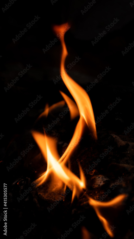 Vertical Fire pattern against black background photograph. Vertical Fire pattern against black background photograph.