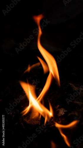 Vertical Fire pattern against black background photograph.