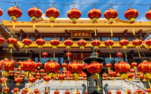 Massive red lanterns hanging in front of Great Buddha's or Main Hall in Qibao Temple, a historic Buddhist monastery in Qibao Old Town, Minhang district, Shanghai, China. photo