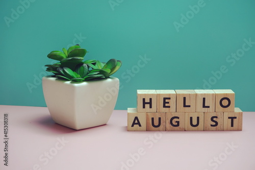 Hello August alphabet letter on blue and pink background