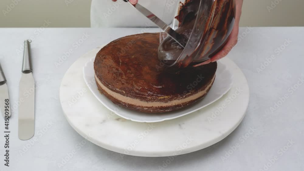 Chef pouring chocolate glaze on top of cake. Chocolate cake step by step recipe, baking process