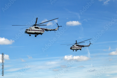 a pair of mi 8 helicopters in the sky