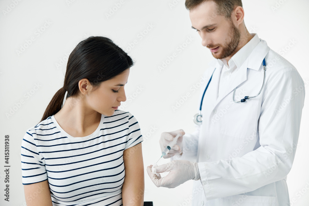 man giving an injection to a patient in the shoulder vaccination health man giving an injection to a patient in the shoulder vaccination health