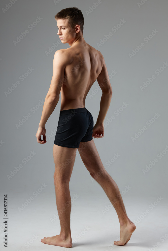 Obraz premium sporty man in black panties pumped up body posing lifestyle