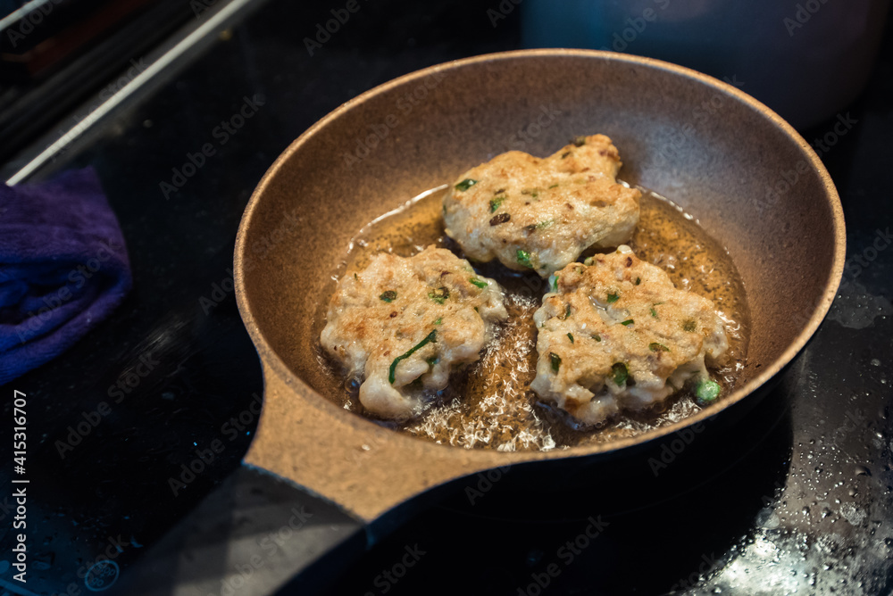 Delicious fried fish cakes closeup in the kitchen. Delicious fried fish cakes closeup in the kitchen.