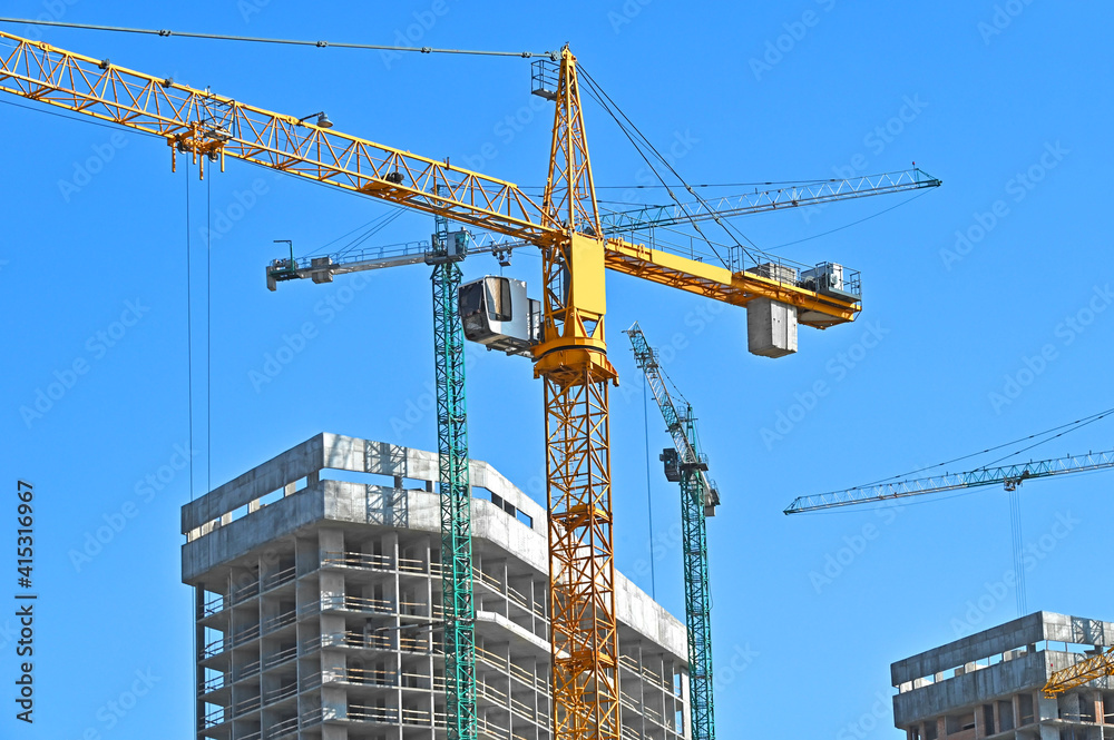 Crane and highrise construction site