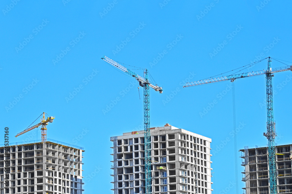 Crane and highrise construction site