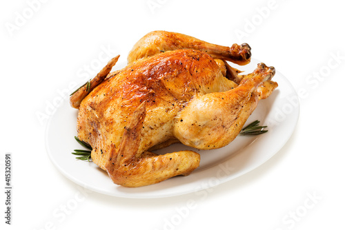 Whole roasted chicken isolated on white background