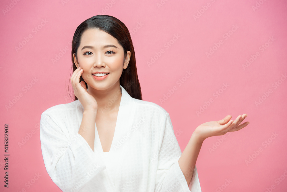 Beauty Woman with perfect make up Portrait. Beautiful spa girl showing empty copy space on the open hand palm for text Beauty Woman with perfect make up Portrait. Beautiful spa girl showing empty copy space on the open hand palm for text