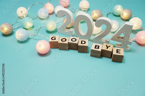 Goodbye 2024 alphabet letters with space copy on blue background