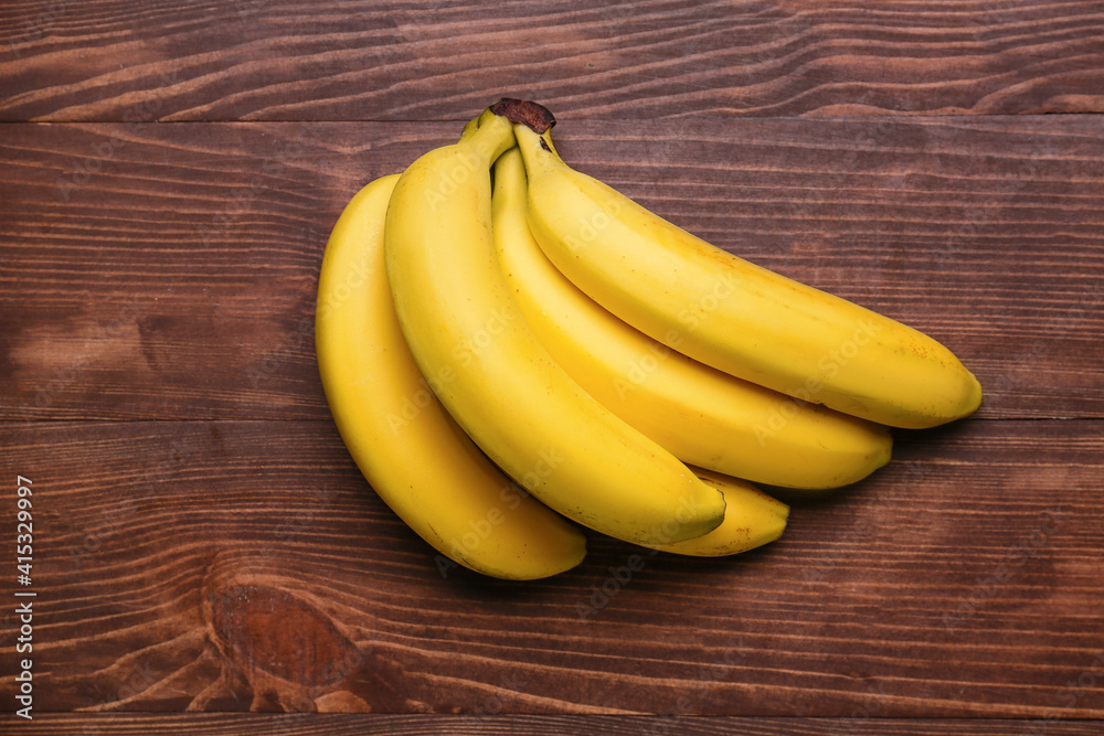 Ripe bananas on wooden background Ripe bananas on wooden background