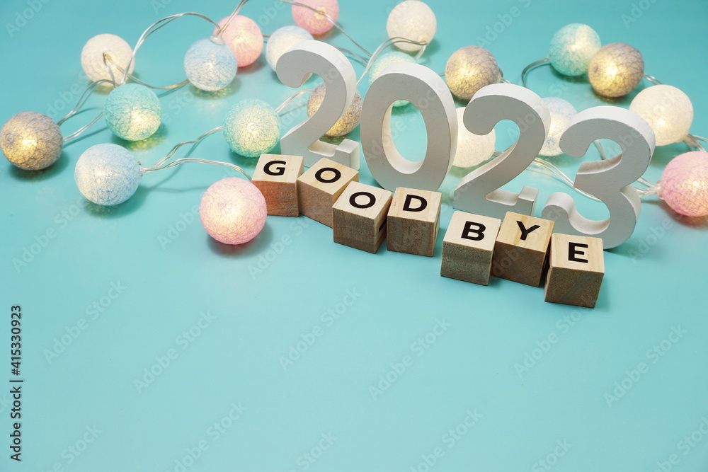 Goodbye 2023 alphabet letters with space copy on blue background Goodbye 2023 alphabet letters with space copy on blue background