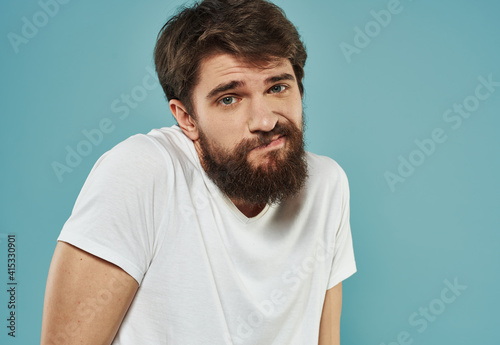 upset man on blue background cropped view Copy Space Model