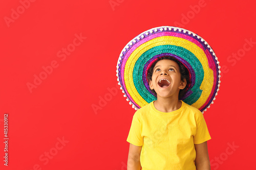 Funny Mexican boy in sombre...