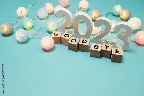 Goodbye 2023 alphabet letters with space copy on blue background