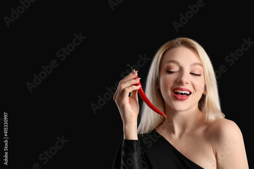 Sexy young woman with chili...