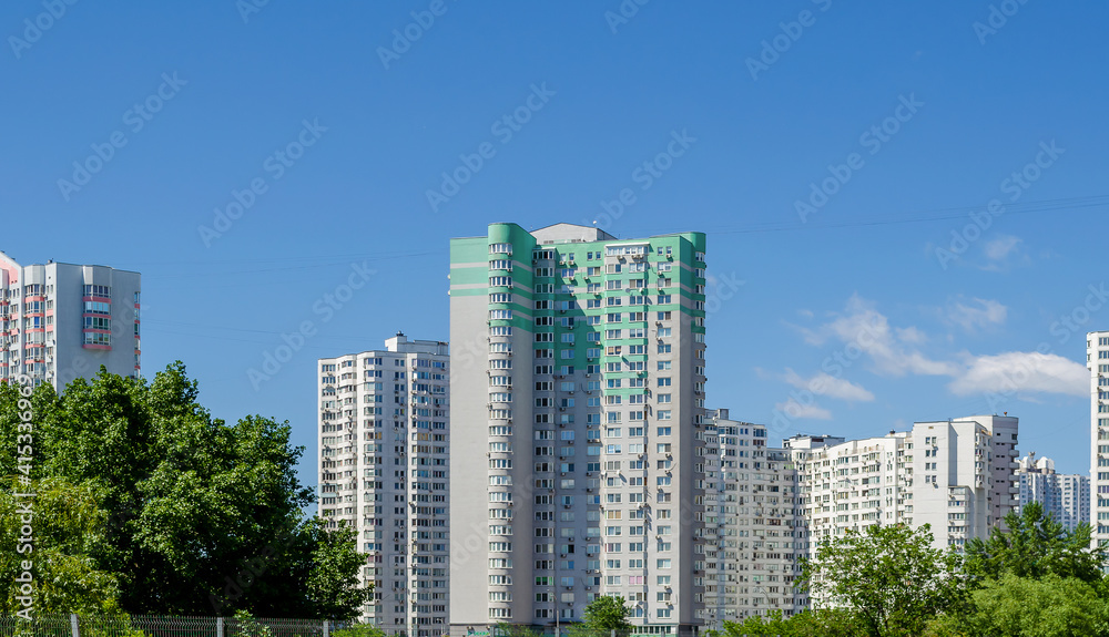 Modern residential apartment with flat buildings exterior. Detail of New luxury house and home complex. Part of City Real estate property and condo architecture. Blue sky
