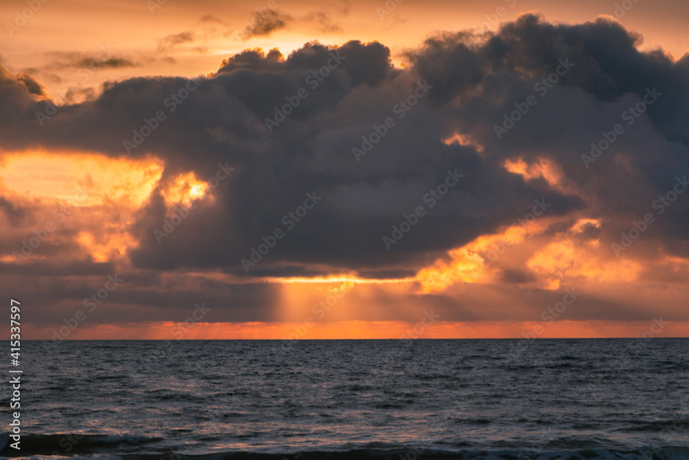 Sunset on the ocean with sun rays, French coast line. Sunset on the ocean with sun rays, French coast line.