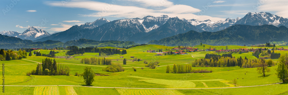 panoramic landscape with meadow and lake in Bavaria, Germany, at springtime
